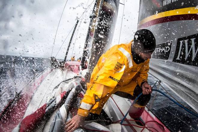 Onboard Abu Dhabi Ocean Racing - Louis Sinclair braces for another bath of cold water during a sail change in the southern ocean - Leg five to Itajai -  Volvo Ocean Race 2015 © Matt Knighton/Abu Dhabi Ocean Racing